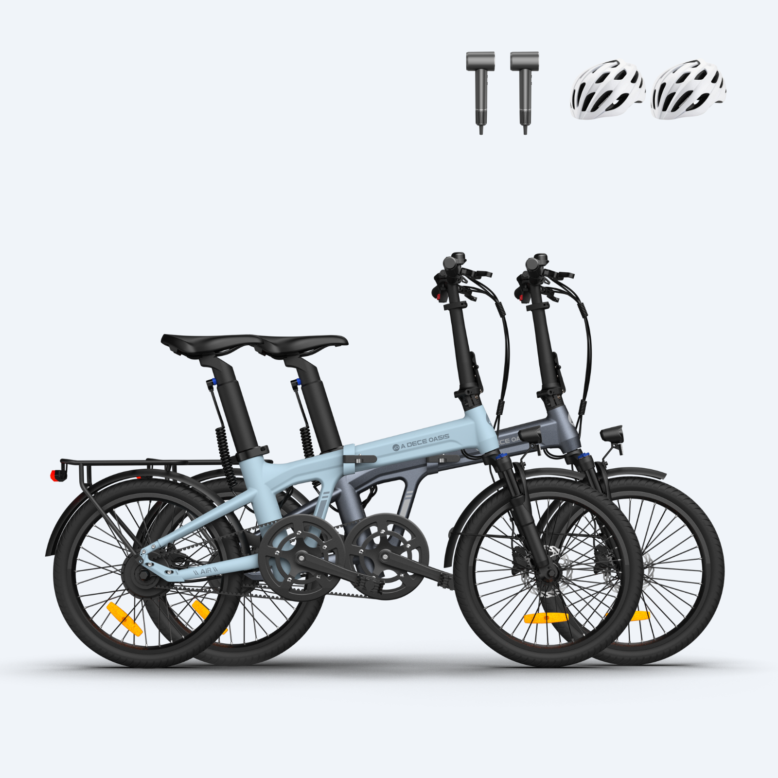 Two foldable electric bikes in blue and gray with racks, disc brakes, and helmets displayed above