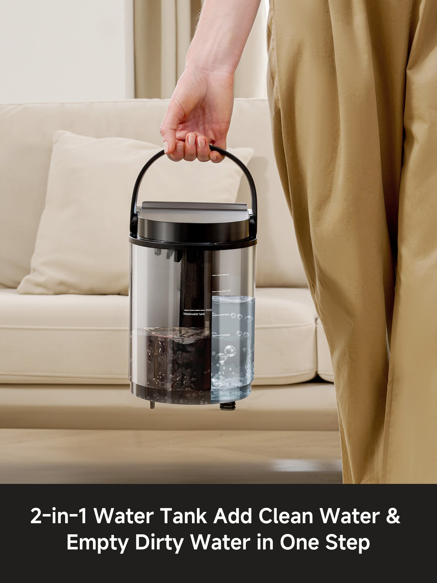Person holding a transparent 2-in-1 water tank with clean and dirty water compartments for spot cleaner