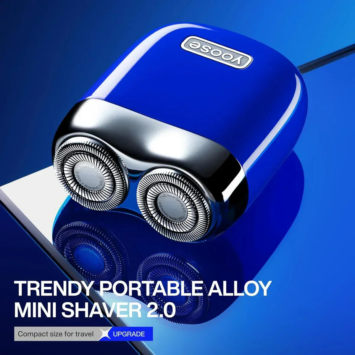 Yoose blue portable alloy mini shaver 2.0 with dual rotary blades on reflective surface