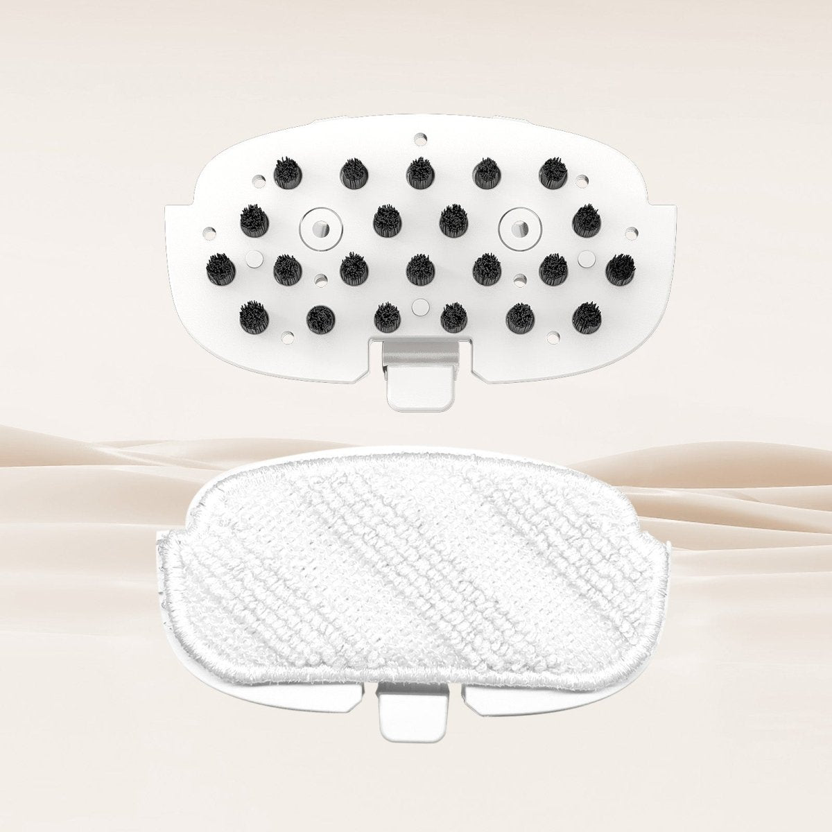 Replaceable brush attachment with black bristles and white microfiber pad for cleaning different surfaces