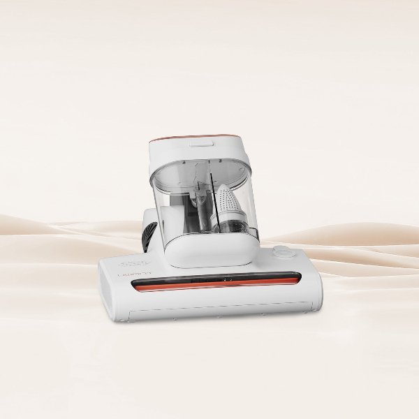 Uwant M300 cordless mattress vacuum cleaner on beige fabric background