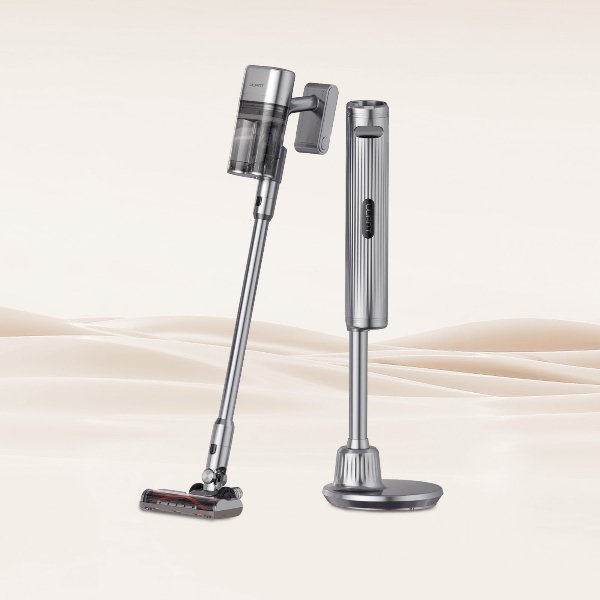 Silver cordless vacuum cleaner with charging dock on a soft beige background